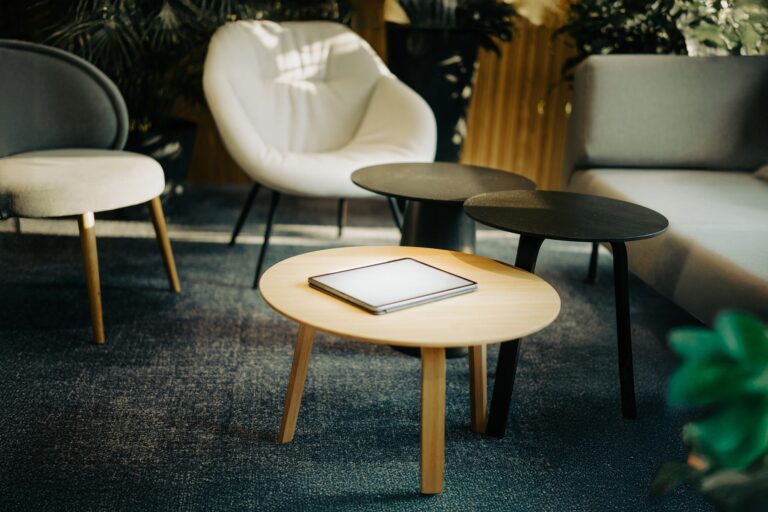 Stylish interior scene featuring a digital tablet on a coffee table in a cozy living room setting.