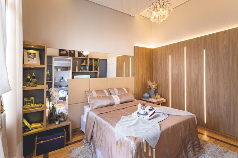 Luxurious modern bedroom featuring elegant decor, soft lighting, and a breakfast tray on the bed.