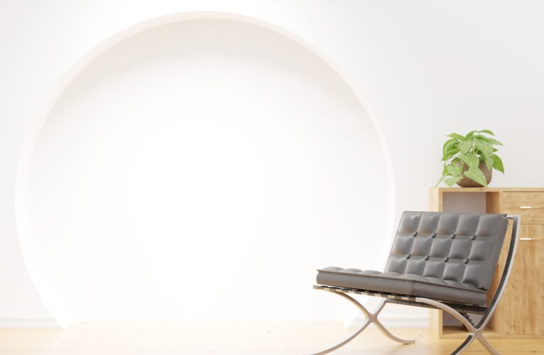 Stylish lounge corner with modern chair and potted plant in minimalist setting.