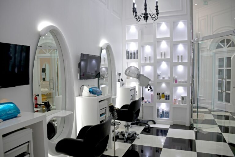 Chic and modern beauty salon interior featuring stylish decor, mirrors, and professional hairdressing equipment.