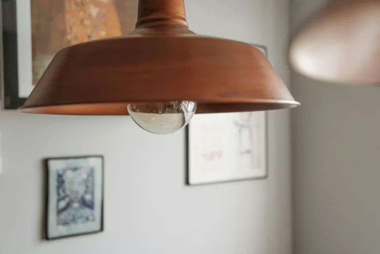 A contemporary close-up of a brown hanging lamp with soft ambient lighting indoors.